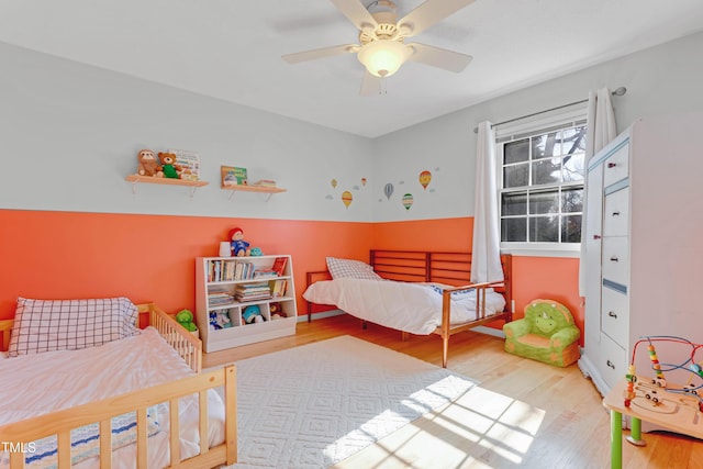 bedroom featuring ceiling fan and light hardwood / wood-style flooring