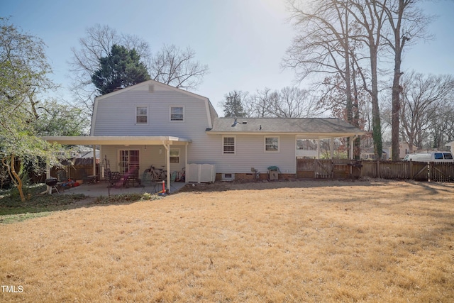 back of house featuring a yard and a patio area