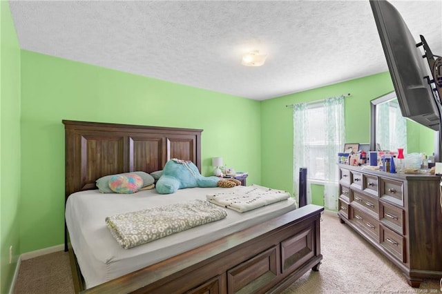 carpeted bedroom with a textured ceiling