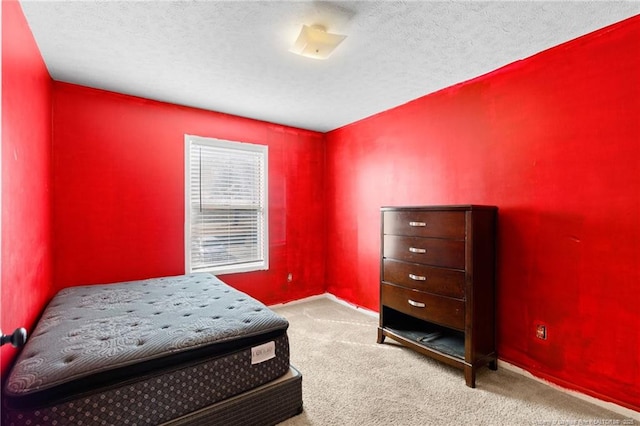 carpeted bedroom with a textured ceiling