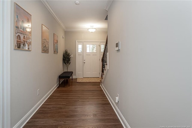 doorway with ornamental molding and dark hardwood / wood-style floors