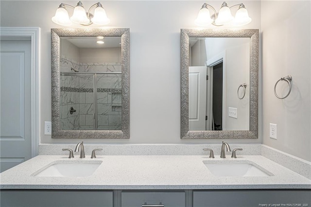 bathroom with vanity, a notable chandelier, and walk in shower