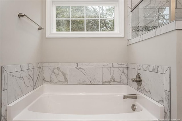 bathroom featuring a washtub