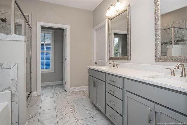 bathroom featuring vanity and a shower with shower door