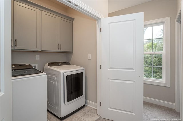 laundry area with cabinets, plenty of natural light, and independent washer and dryer