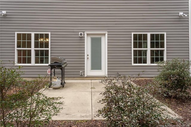 entrance to property featuring a patio area