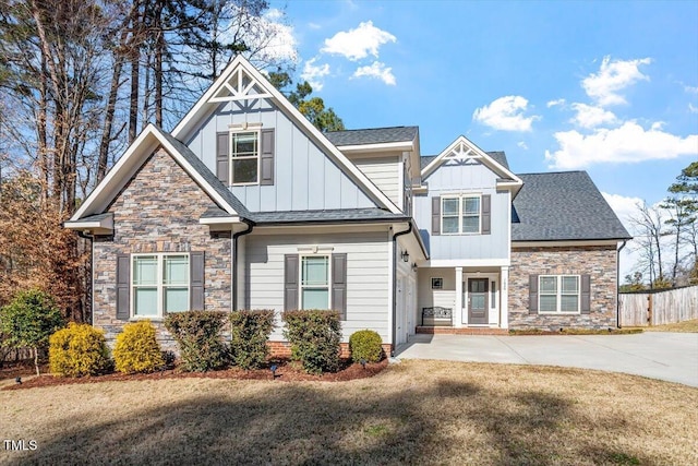 craftsman inspired home with a front yard