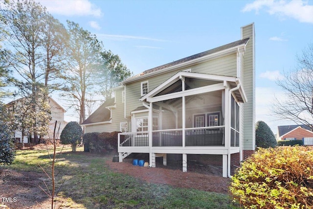 rear view of house with a sunroom