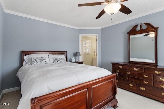 carpeted bedroom with crown molding, a textured ceiling, ceiling fan, and ensuite bathroom