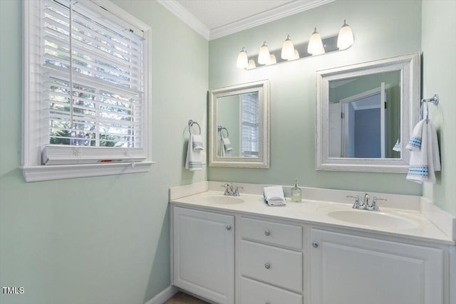 bathroom featuring crown molding and vanity