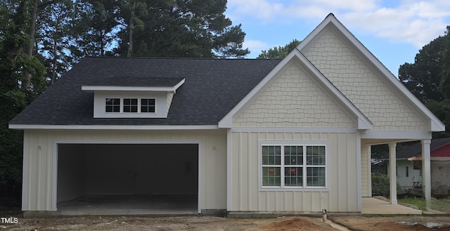 1203 Elizabeth Rd W, Wilson, NC 27896 - view of front of home featuring roof with shingles, board and batten siding, and driveway