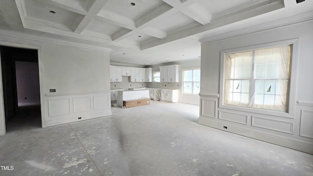 1203 Elizabeth Rd W, Wilson, NC 27896 - unfurnished living room with ornamental molding, beam ceiling, wainscoting, coffered ceiling, and a decorative wall