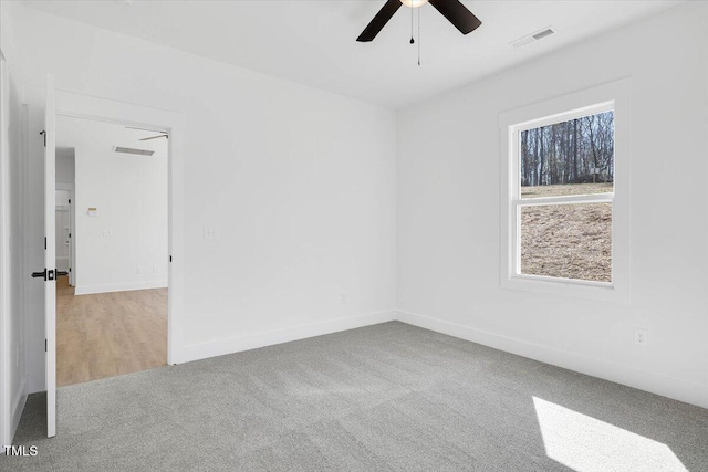 carpeted empty room with ceiling fan