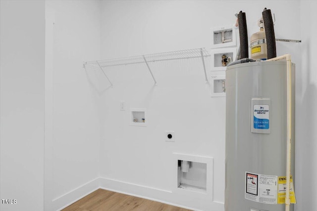 laundry area with water heater, washer hookup, wood-type flooring, and hookup for an electric dryer