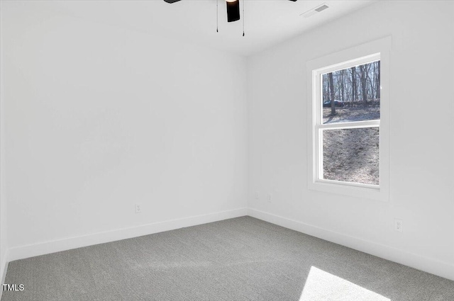 unfurnished room with carpet and ceiling fan