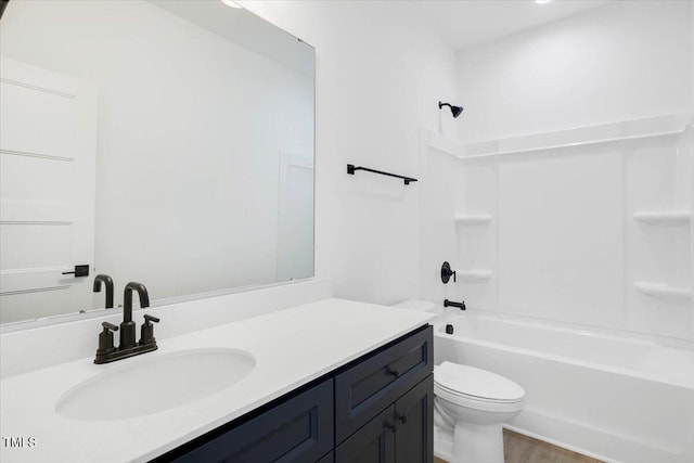 full bathroom featuring shower / washtub combination, vanity, and toilet