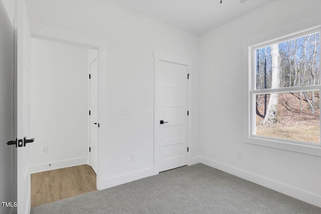 unfurnished bedroom with carpet flooring