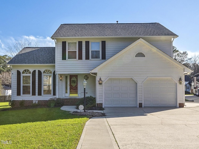 view of front of property with a garage and a front yard