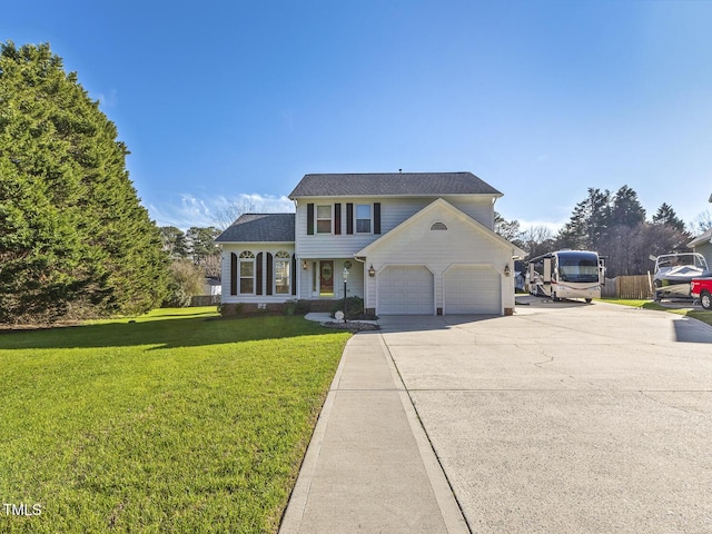 view of front facade with a garage and a front lawn