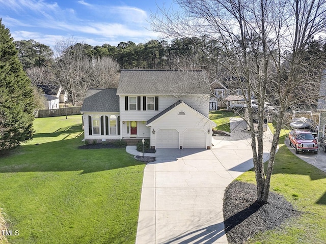 view of front of house with a garage and a front lawn