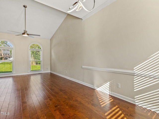 unfurnished living room with dark wood-type flooring, high vaulted ceiling, and ceiling fan