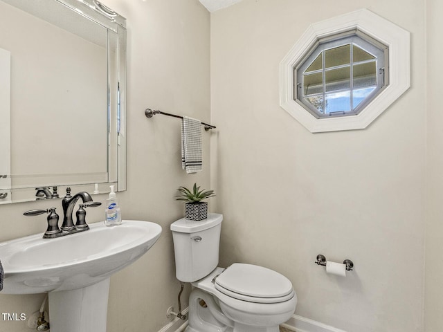 bathroom with sink and toilet