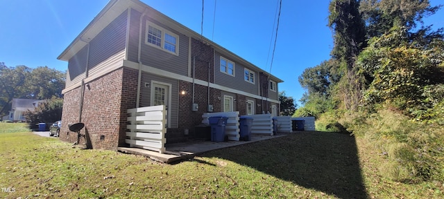 view of home's exterior with a lawn