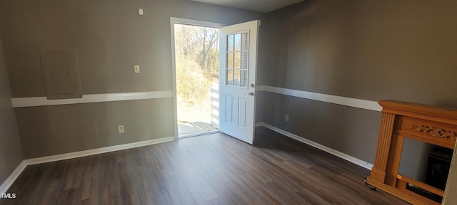 entryway with dark hardwood / wood-style flooring and electric panel