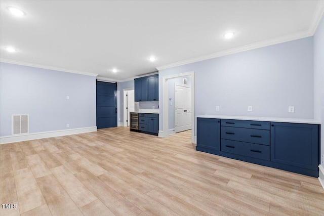 interior space featuring visible vents, baseboards, light wood-style flooring, crown molding, and recessed lighting