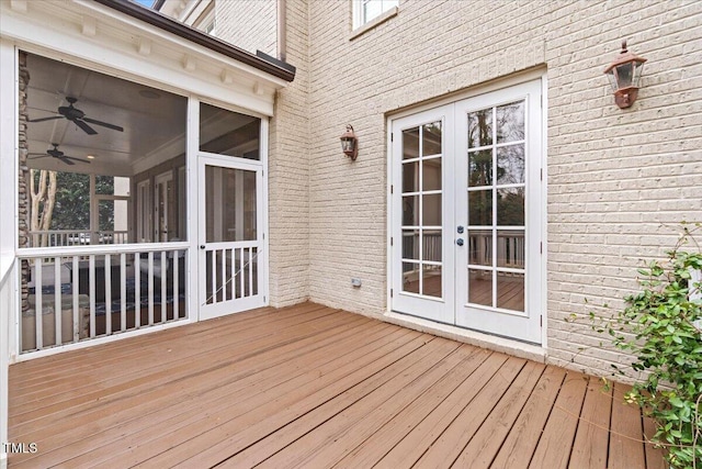 wooden terrace with a sunroom and french doors