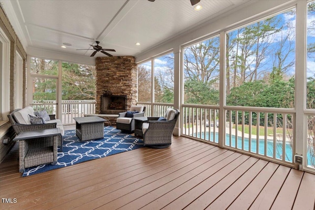 sunroom with a ceiling fan