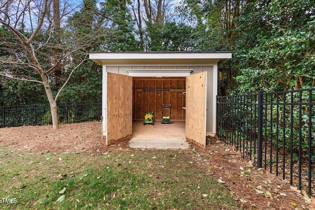 view of shed with a fenced backyard