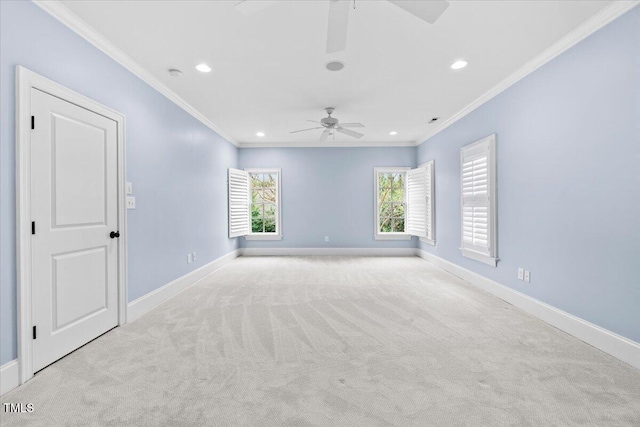 carpeted spare room featuring ornamental molding, recessed lighting, and baseboards