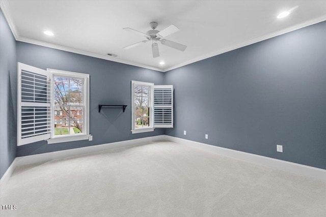 unfurnished room with baseboards, a ceiling fan, carpet, crown molding, and recessed lighting