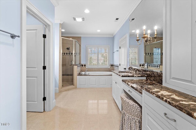 bathroom with visible vents, vanity, ornamental molding, a bath, and a stall shower