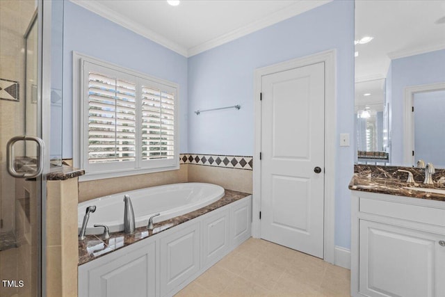 bathroom featuring a garden tub, crown molding, a shower stall, and vanity