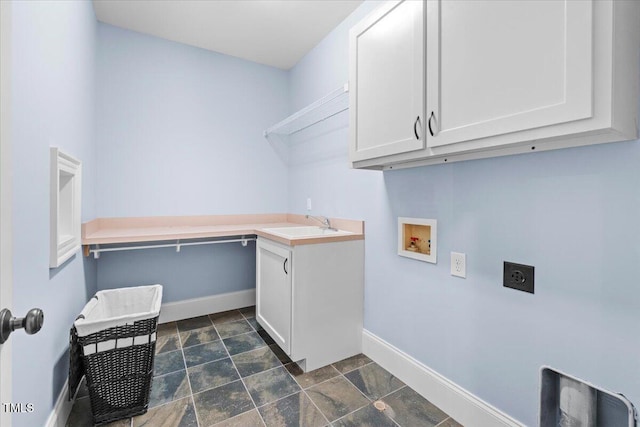 laundry area featuring washer hookup, hookup for an electric dryer, cabinet space, and baseboards