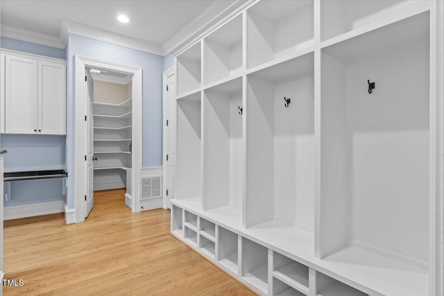 mudroom featuring ornamental molding, recessed lighting, visible vents, and light wood-style floors