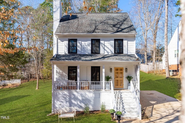 view of front of property featuring a porch and a front lawn