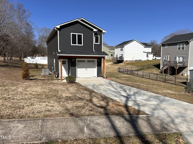 view of front of house with a garage and a front lawn