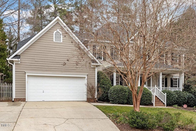 view of front of property featuring a garage and covered porch