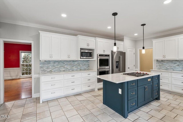 kitchen featuring blue cabinetry, stainless steel appliances, white cabinets, a kitchen island, and decorative light fixtures