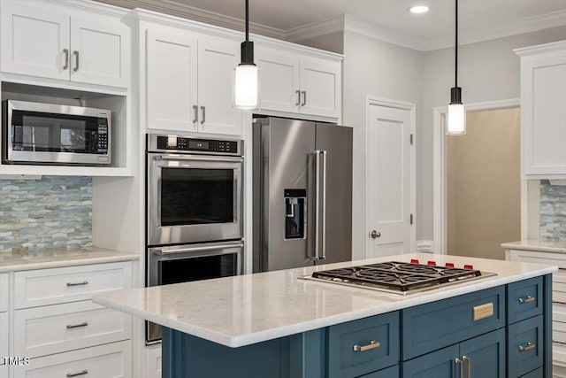 kitchen with stainless steel appliances, pendant lighting, blue cabinets, and white cabinets