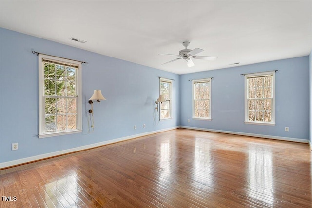 unfurnished room featuring ceiling fan and light hardwood / wood-style flooring