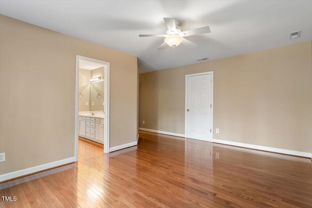 unfurnished room featuring light hardwood / wood-style flooring and ceiling fan