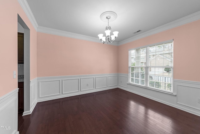 empty room featuring a notable chandelier, wood-type flooring, and ornamental molding