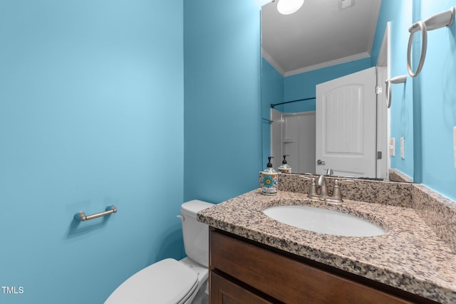 bathroom featuring crown molding, walk in shower, vanity, and toilet