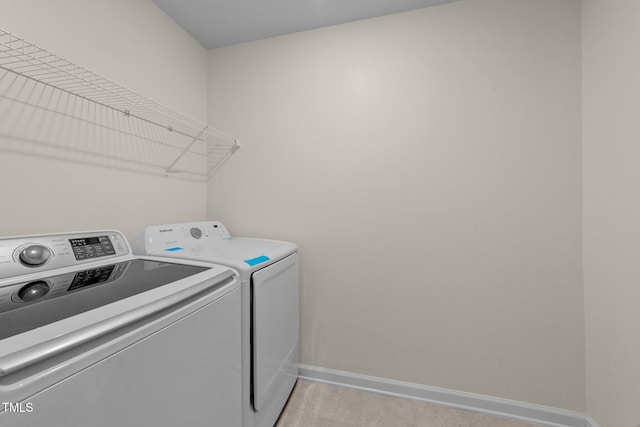 washroom with washer and dryer