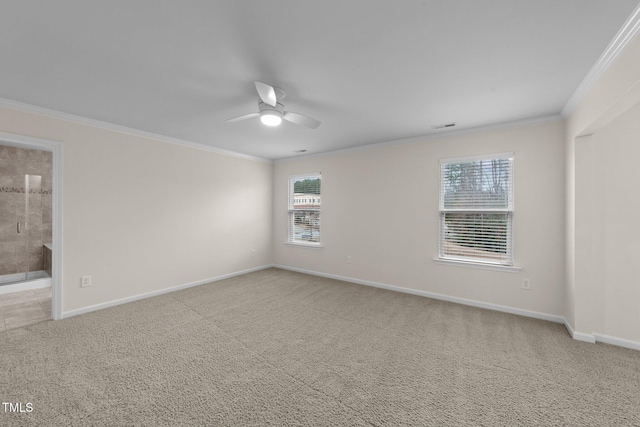 spare room with crown molding, ceiling fan, and carpet flooring