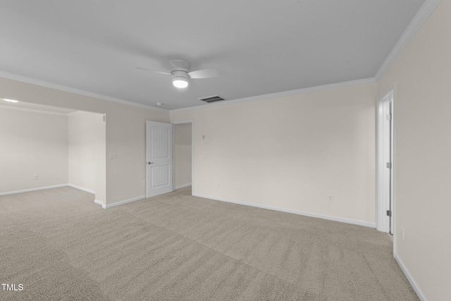 carpeted spare room with crown molding and ceiling fan